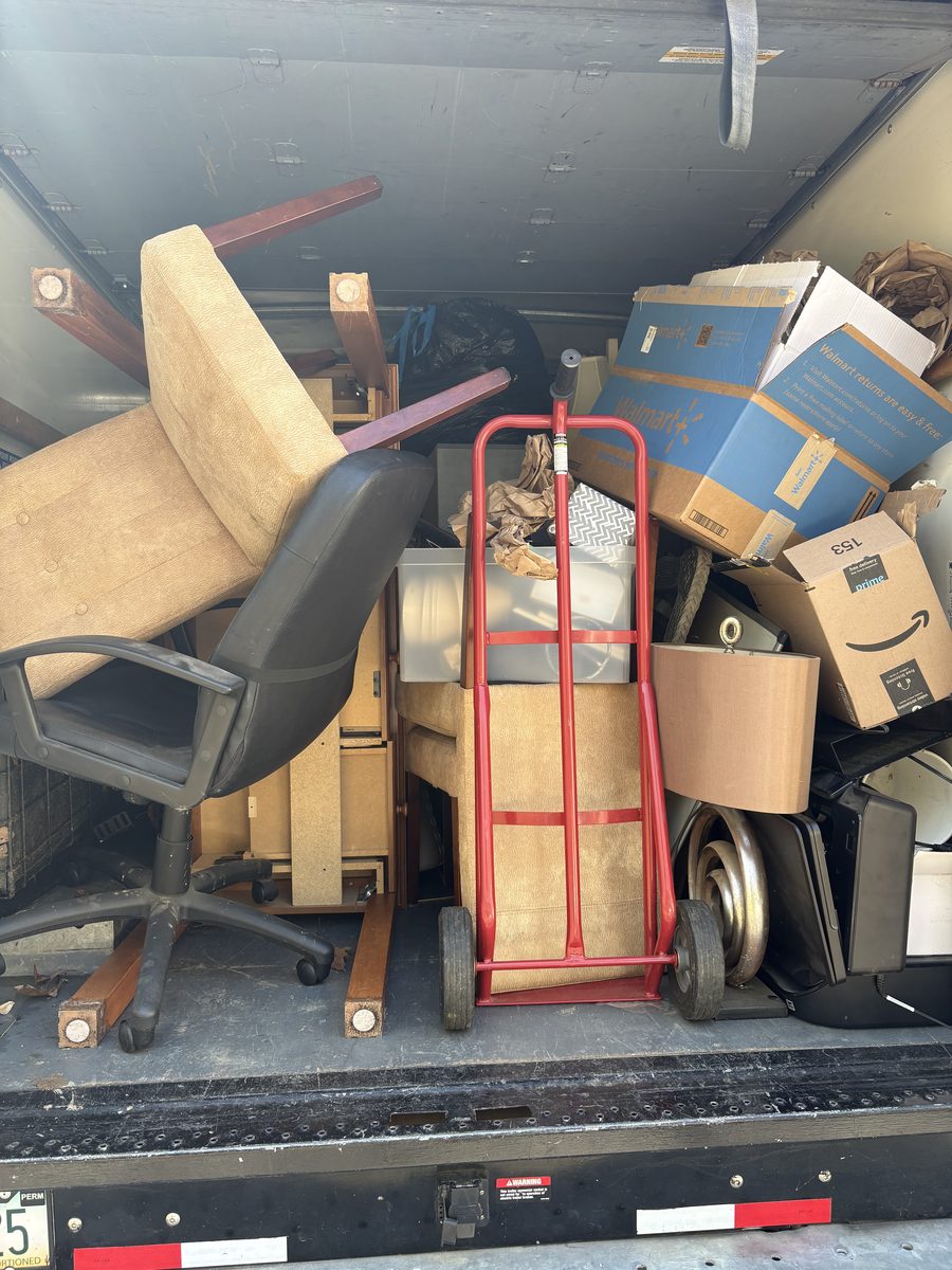 Fully loaded junk removal truck — Albemarle Moving Charlottesville VA