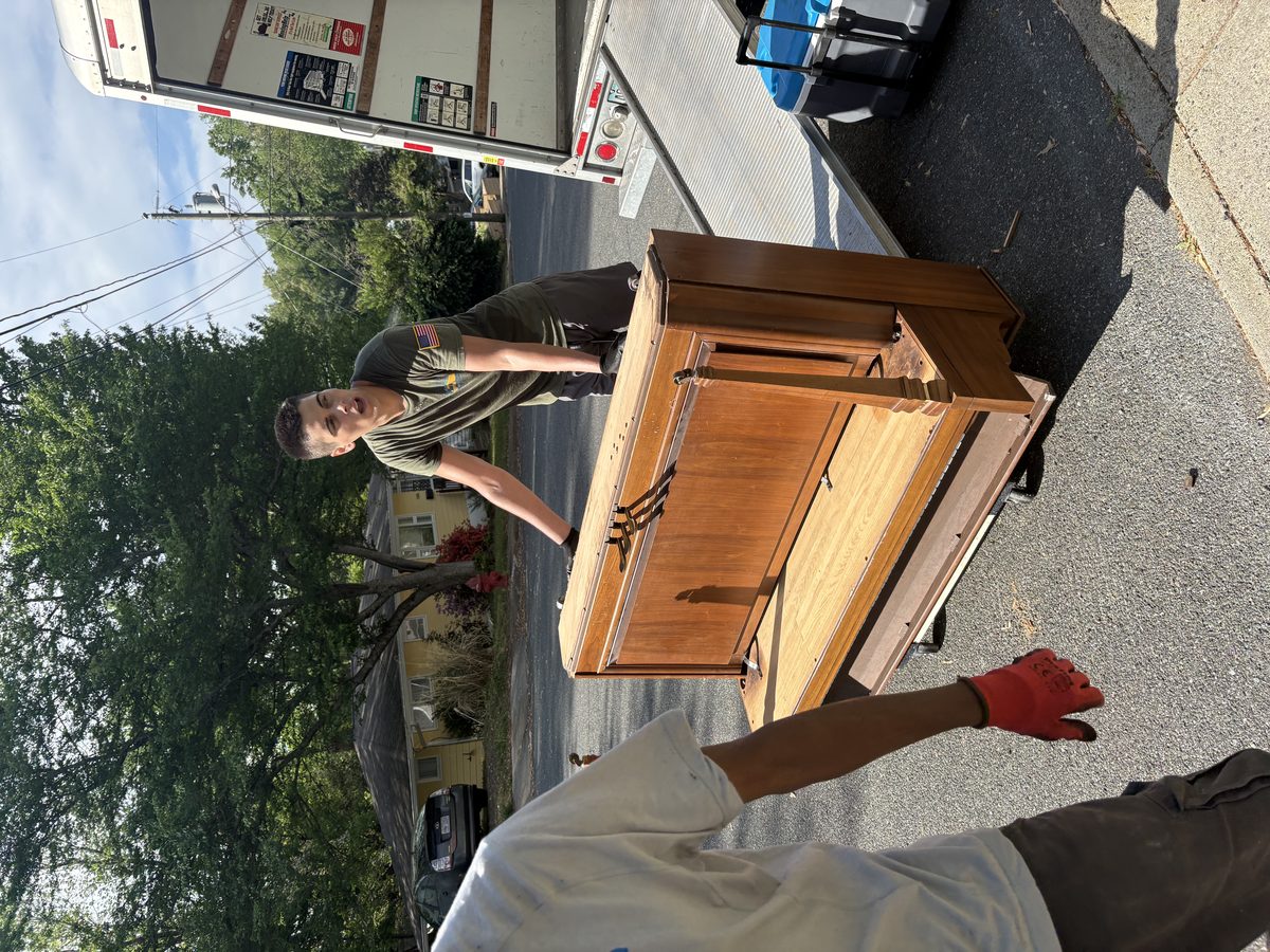 Albemarle Moving crew loading upright piano onto truck Charlottesville VA