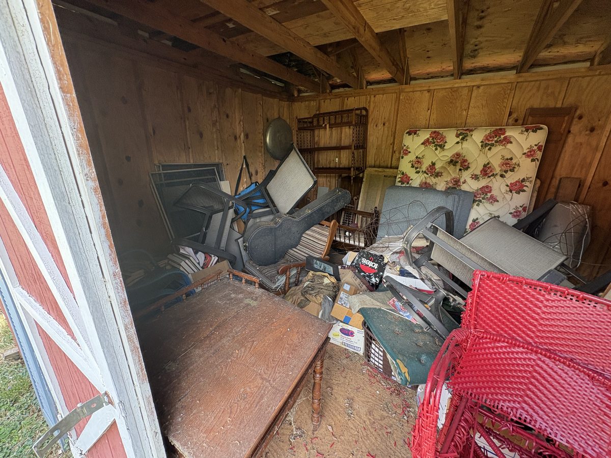 Red wicker chairs mattress inside shed Charlottesville VA